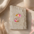 Roze semi-transparante druppel oorbellen Charlotte Earrings van hi SISU op steen